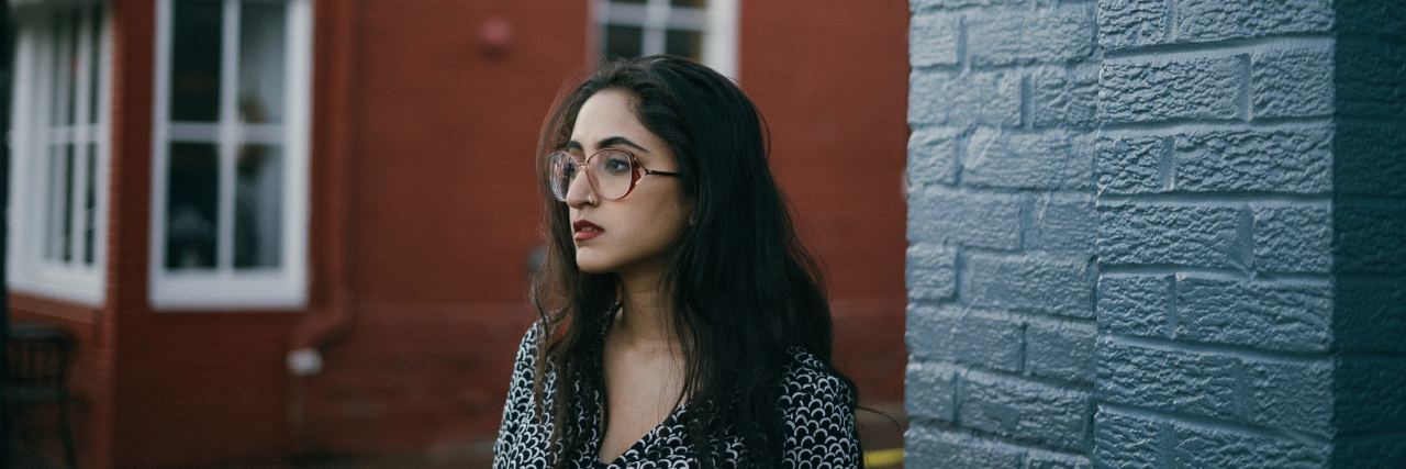 The One Thing That Got Me Though College as Someone With Depression college student standing on the street