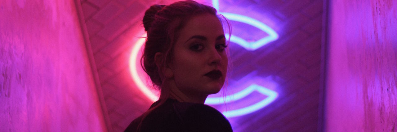 The Most 'Embarrassing' Part of My Mental Health Recovery woman in neon lights