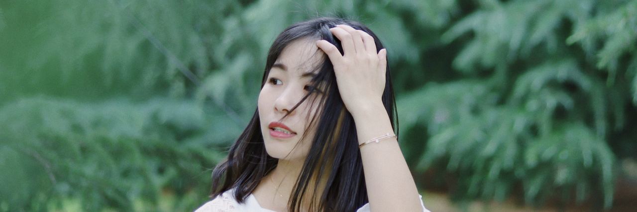 4 Resources I Wish I Knew About in Eating Disorder Recovery asian woman with hair blowing in the wind
