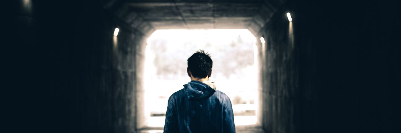 What Is Post-Traumatic Growth? man standing in tunnel