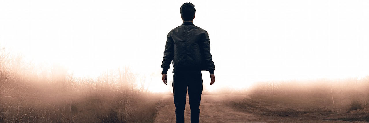 Coping With Depression as a Cancer Survivor A man walking in a road