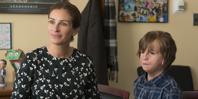 A picture from the film "Wonder" with Julia Roberts sitting by her son Auggie