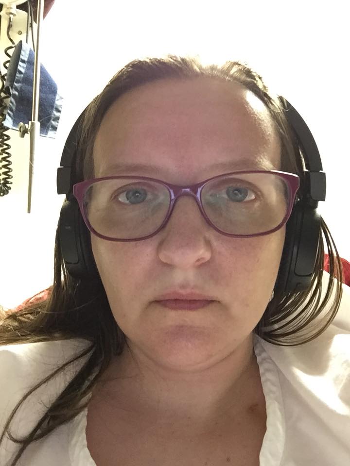 woman wearing glasses and headphones