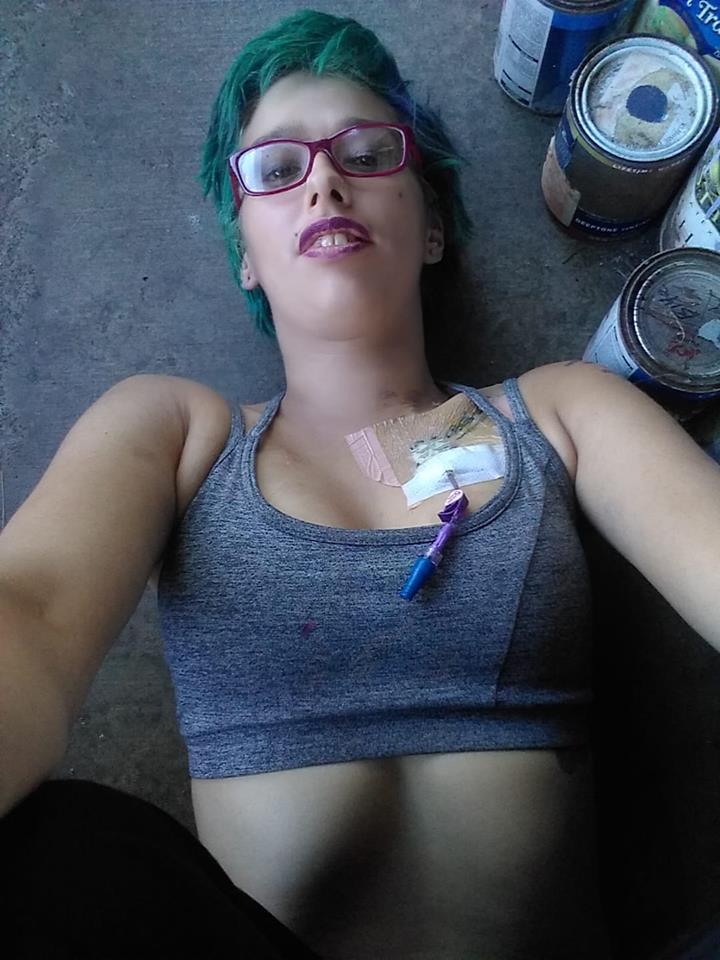 woman lying on a concrete floor