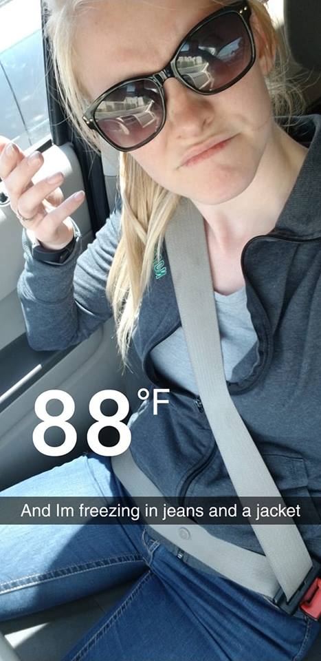 woman wearing jeans and a jacket in 88 degree weather