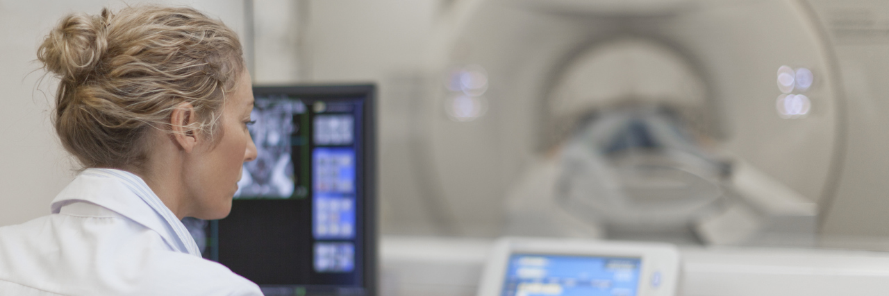 When the Best Thing You Can Do for Your Illness Is Give Up Control A doctor running an MRI machine.