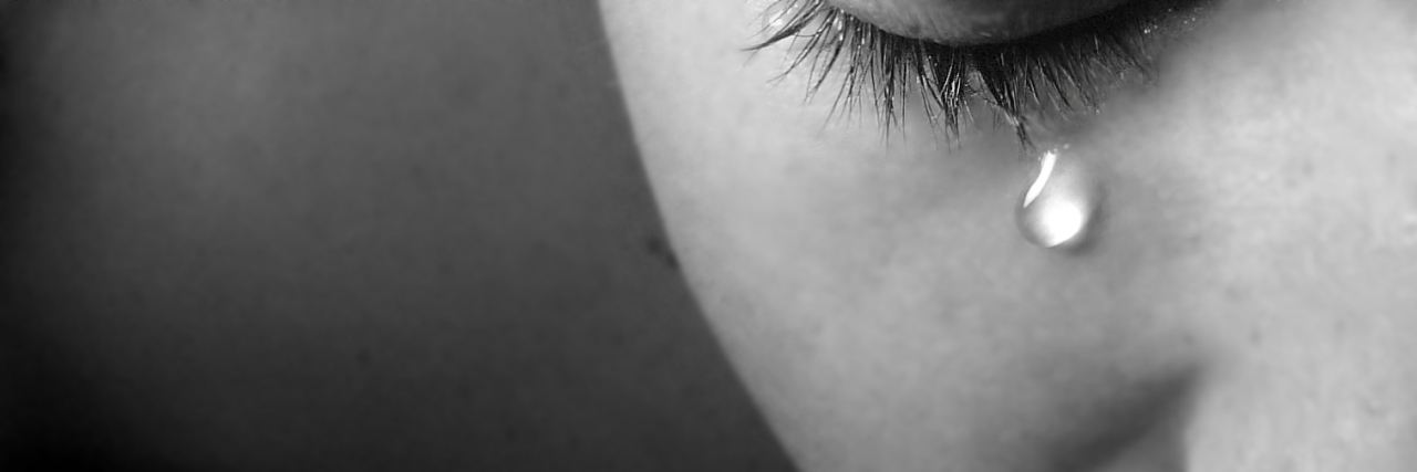 4 Things You Can Do If Your Doctor Is Causing You More Pain A black and white image of a woman crying.