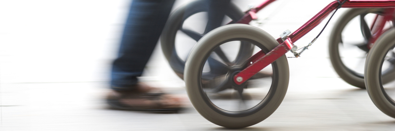 Why We Shouldn't Test Our Physical Limits to Make Others Comfortable A picture of a person's legs moving, with a walker in front of them.