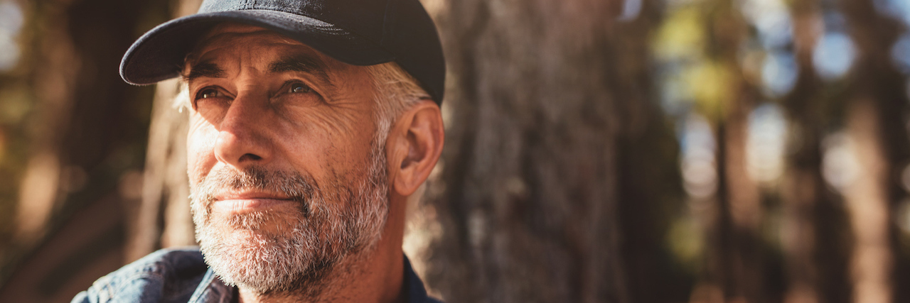 older man sitting outside