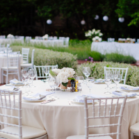 Table set for outdoor wedding reception.