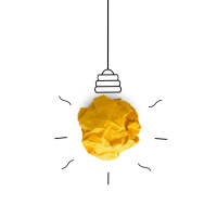 A wadded up piece of yellow paper, turned into a light bulb.