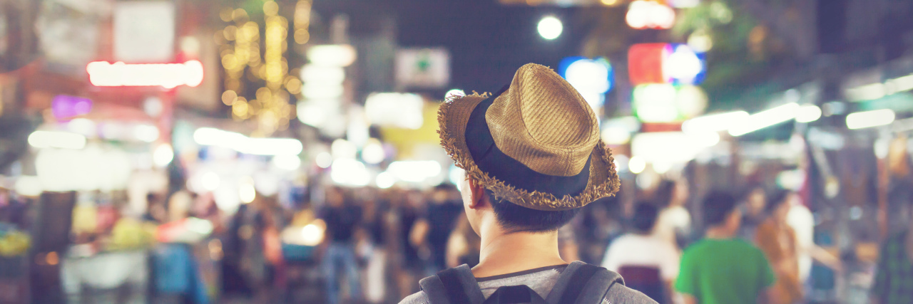 Why Having So-Called 'High Functioning' Autism Is Hard Man walking in the city at night.