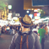 Man walking in the city at night.