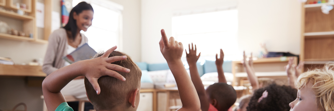 Pushing Through Severe Chronic Pain Teacher with young students.