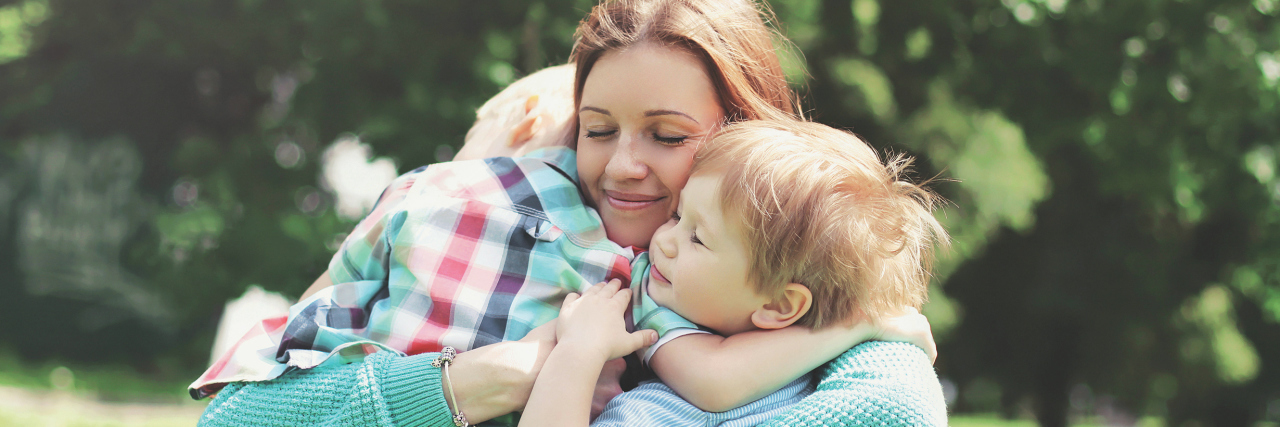 When Chronic Illness Makes Happy Moments With My Kids Bittersweet Happy smiling mother is embracing children at summer day