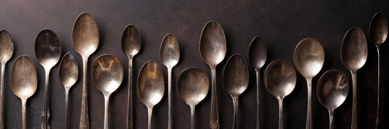 You Know You're a Spoonie When... A row of vintage looking spoons.