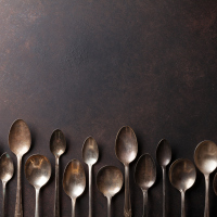 A row of vintage looking spoons.