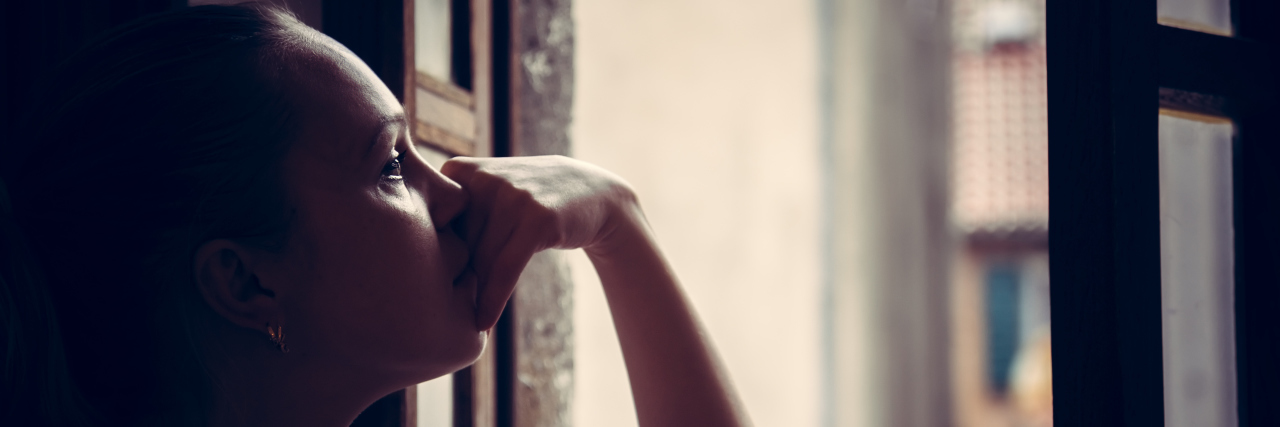 When Rare Disease Affects Your Ability to Have Children Pensive thoughtful young woman lost in thoughts dreaming and looking into opened window in vintage style with dramatic mood