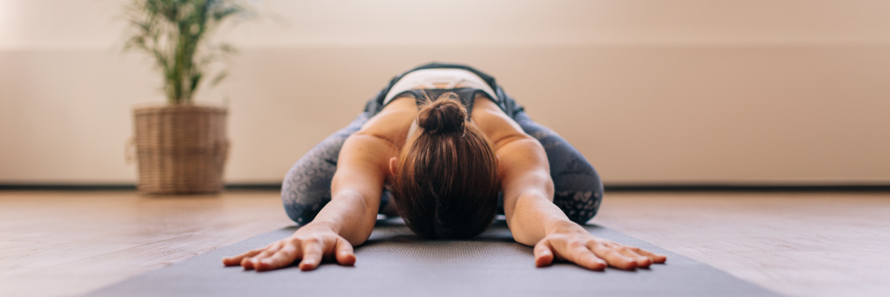 Benefits of Yoga for Mild Cerebral Palsy Woman doing yoga.