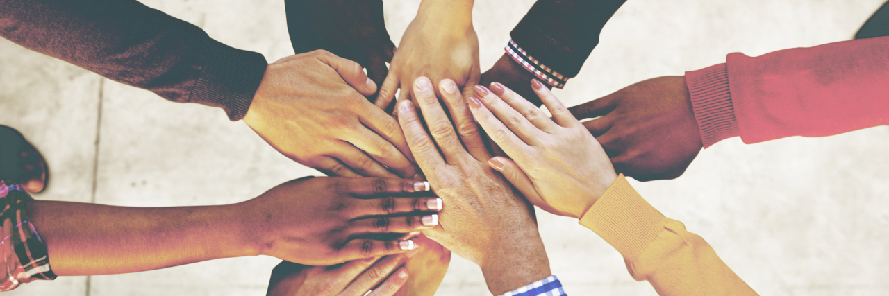 The Fight for Dup15q Syndrome and Rare Disease Aerial view of supported hands out together