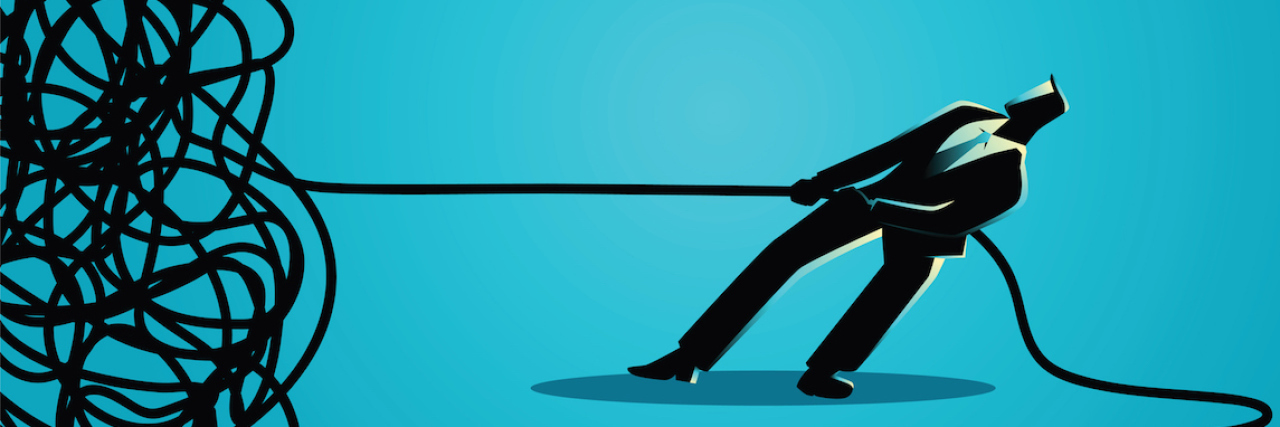 7 Steps to Help Untangle Yourself From Enmeshment A man pulling on a tangled string