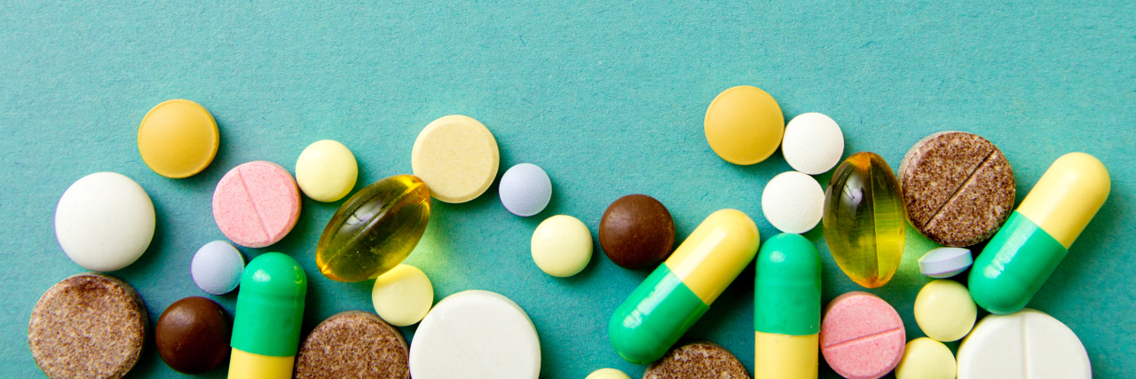 Various pills on a blue background