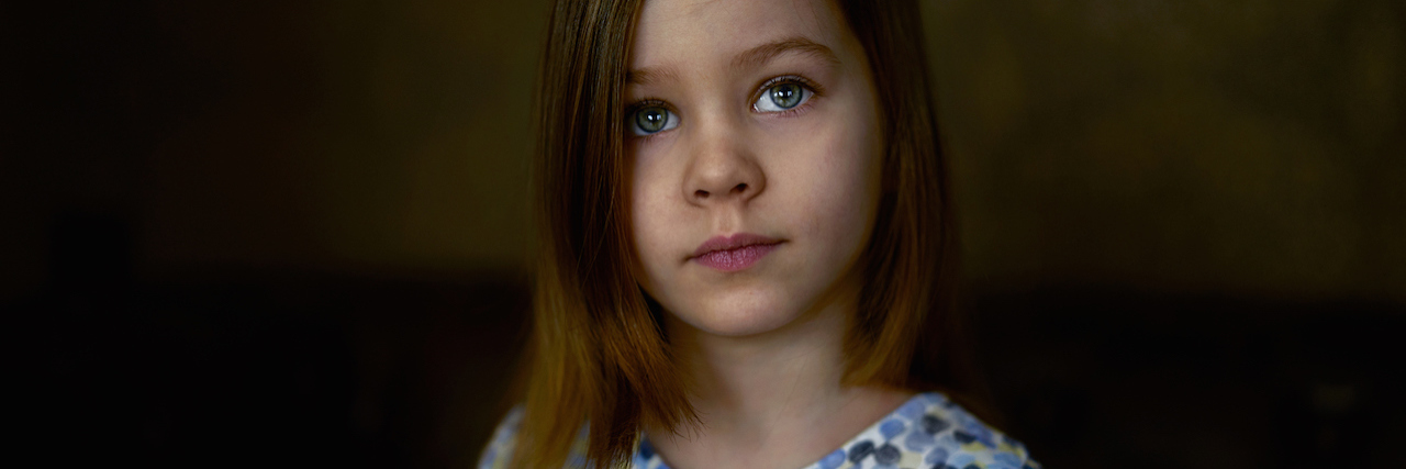A young girl who looks sad