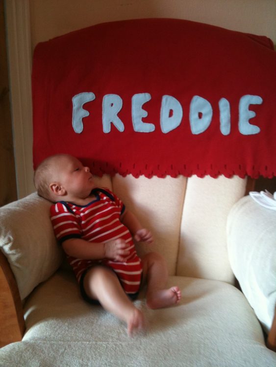 the author's son sitting on a sofa, with his name "Freddie" above him