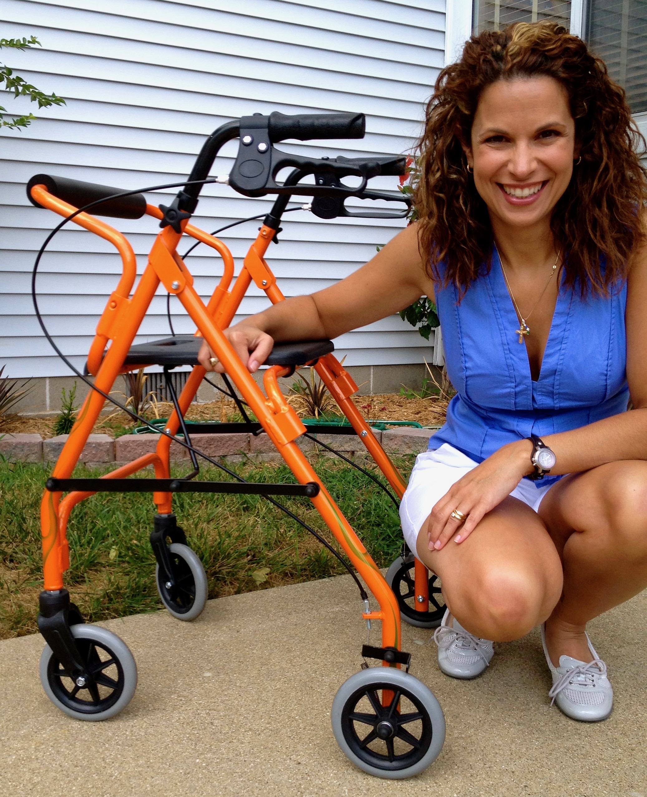 A picture of the writer next to her orange walker.