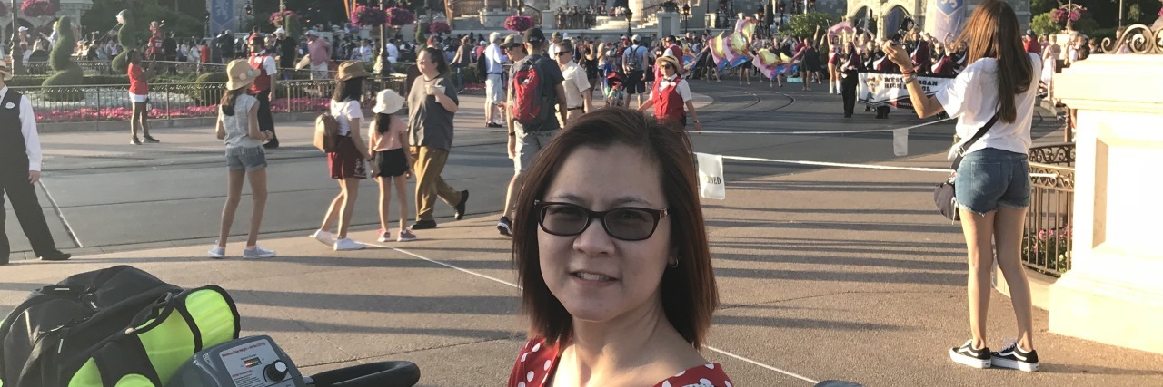 Using a Scooter for Chronic Lyme Disease At Disney World Vickie at Disney World in a rented scooter.