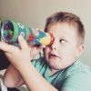 Boy with autism looking through kaleidoscope