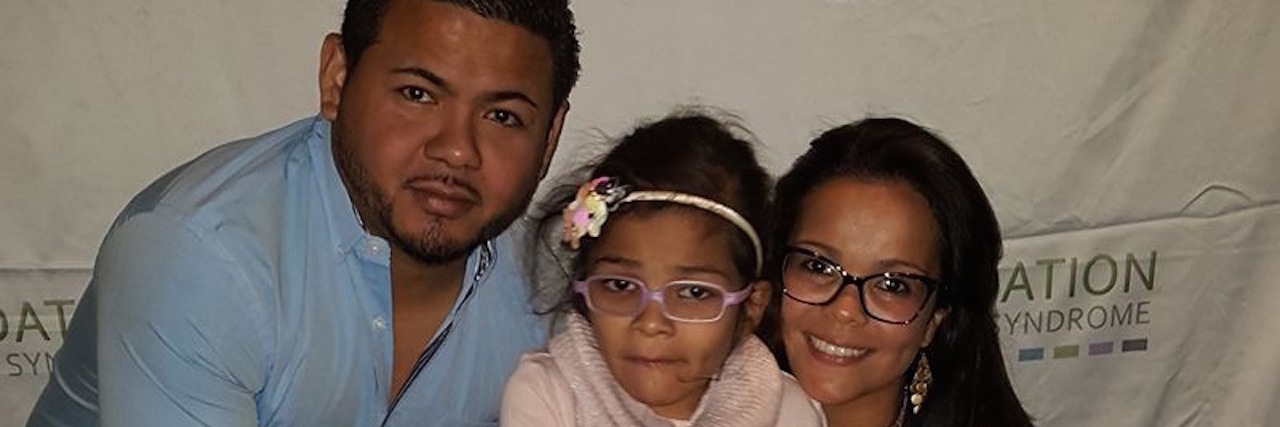 Parenting a Child With Lennox Gastaut Syndrome: What to Know Kelly with her daughter and husband smiling