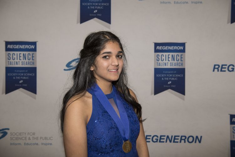 Regeneron Science Talent Search 2018 -- isani smiling with a medal