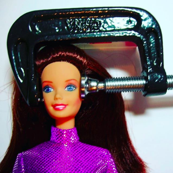 barbie's head being squeezed