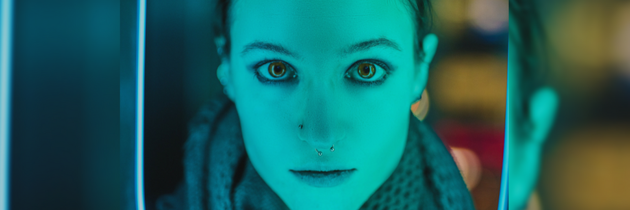 6 Kinds of Dissociation — and What It's Like to Experience Them woman face turquoise hue