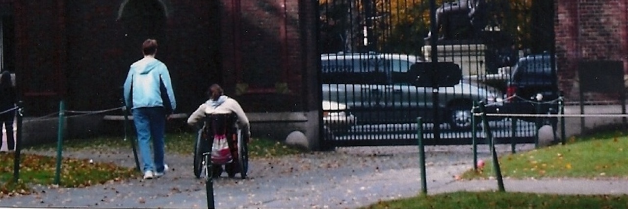 Gifts of Caregiving as a Profession and as a Parent Mom and daughter in wheelchair going into Harvard