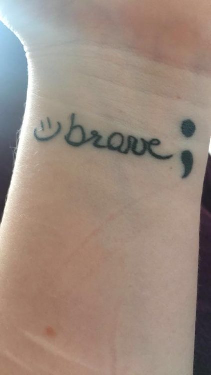 tattoo of brave with semi colon and smiley face