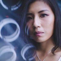 asian woman looking serious at camera close up