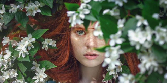 When You Realize You Don't Have 'High-Functioning' Depression Anymore woman hiding in flower bush