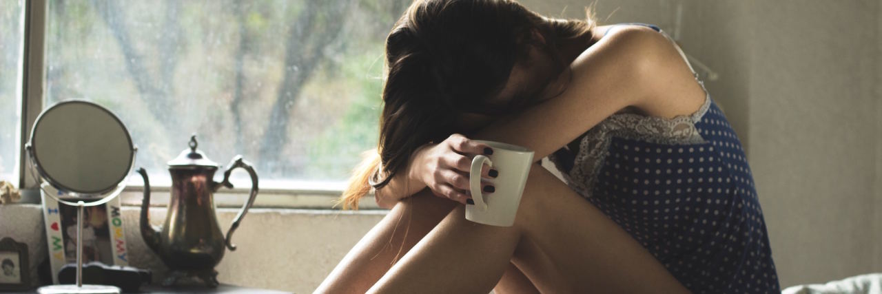 My Anxiety Isn't 'Quirky' — It’s Exhausting woman head in hands