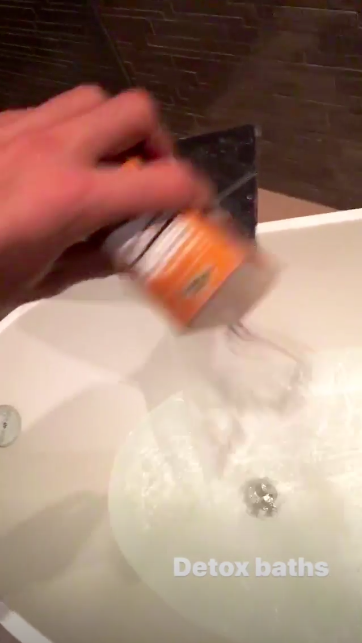 pouring salt into bath for detox bath