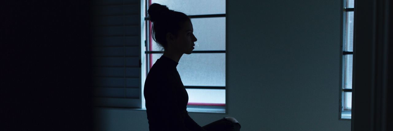 Blindness and Insomnia Shadow outline of a woman sitting on her bed. There is pale light coming through the window behind her. Photo by Ben Blennerhassett on Unsplash