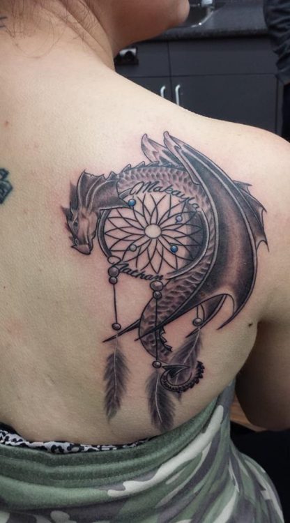 dream catcher tattoo on woman's back