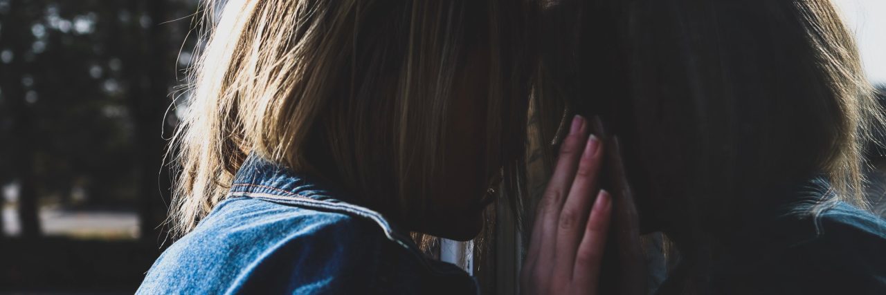 A Letter to My Body, From a Girl Struggling With Self-Harm young woman leaning against her reflection upset