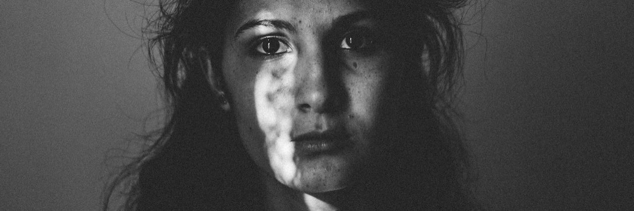 Suicidal People Don’t Want to Die, They Just Want the Pain to Stop Black and white picture of a woman