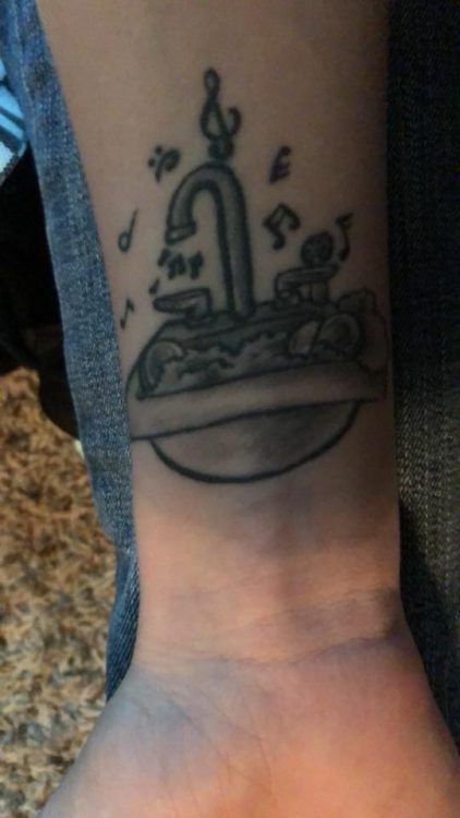 sink tattoo on wrist