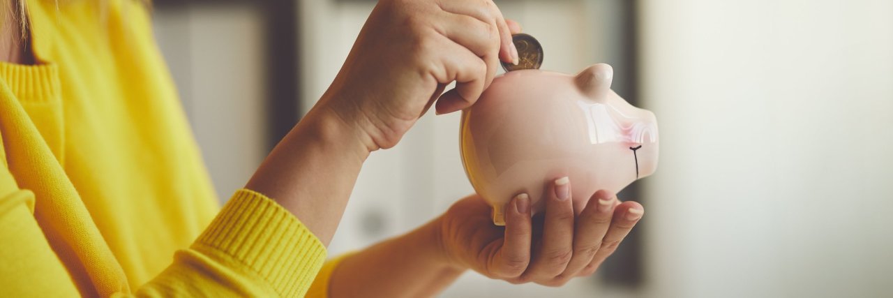 When My Health Prevents Me From Contributing Financially woman putting money into a piggy bank