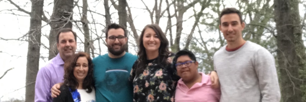 'Born This Way' Parents Are My Heroes Group photo of 6 people, one is a teenage boy with Down syndrome