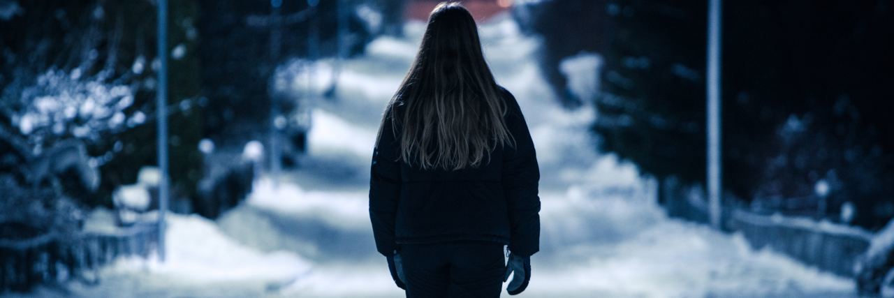 Victim of Police Brutality Because of Mental Illness woman at night in snowy park