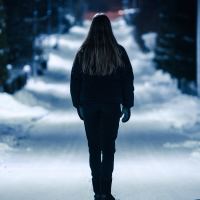 woman at night in snowy park